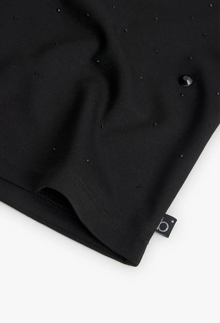 Girls' black knit jersey shirt.