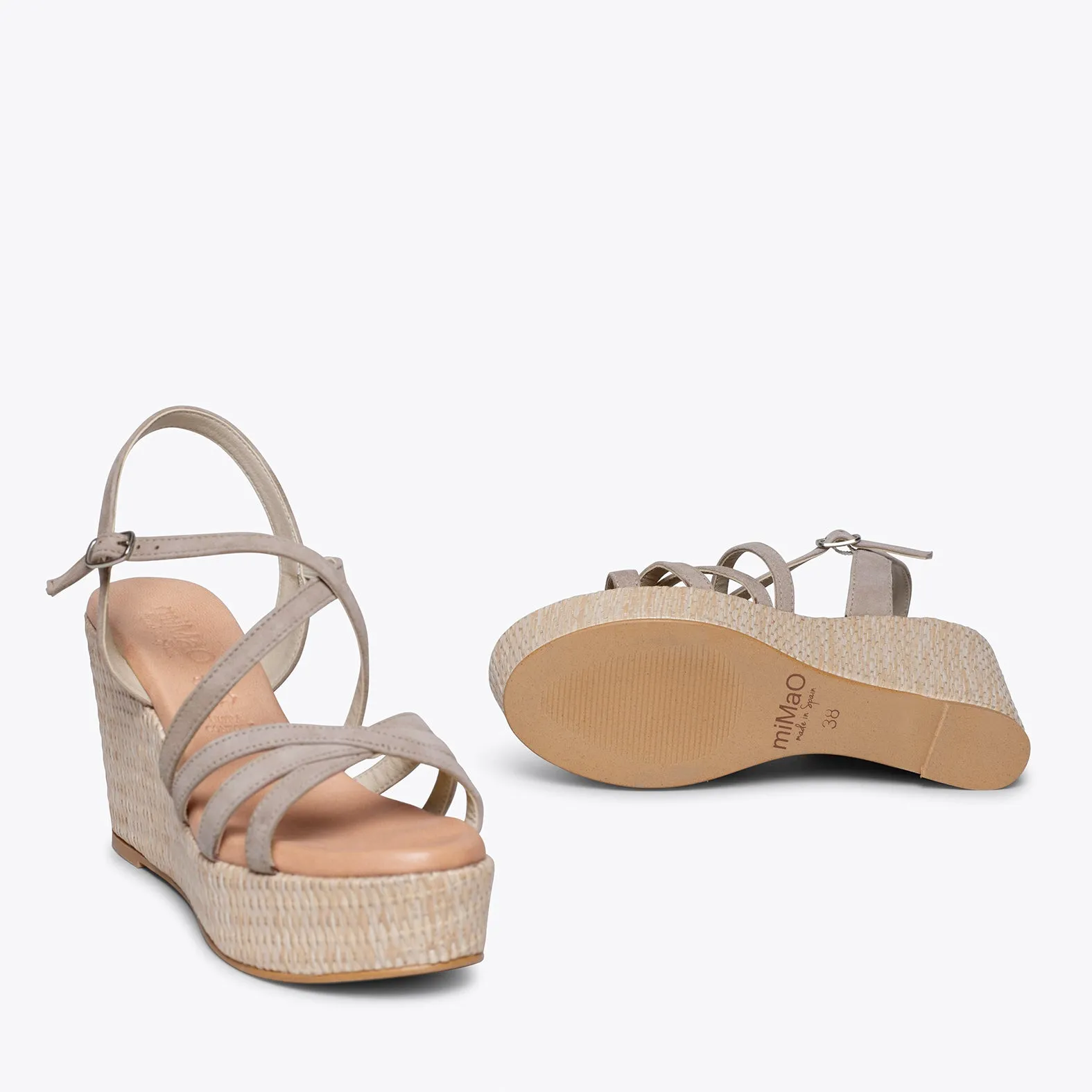 Platform wedge sandals with raffia and crisscross straps in taupe color
