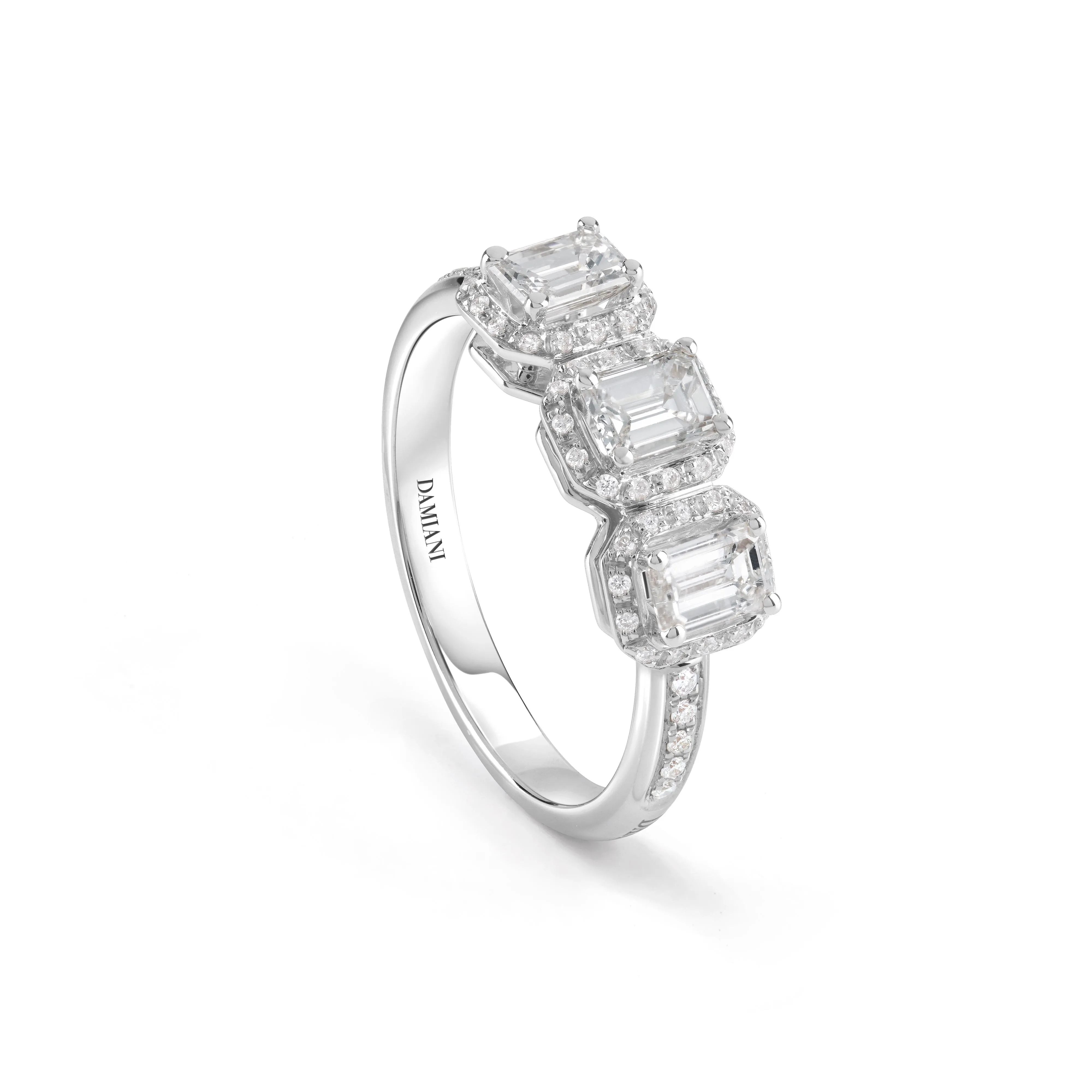 White gold ring with three emerald-cut diamonds.